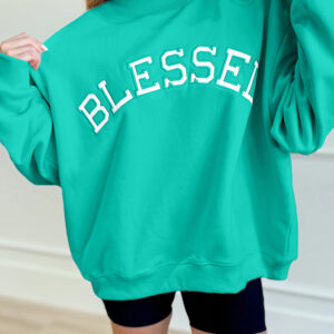 Buzo Verde Mar Bordado Oversize Cuello Alto